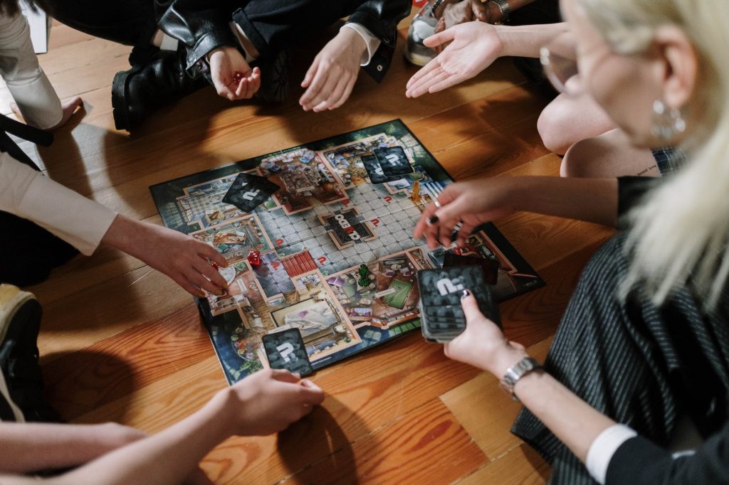 a group of people playing a board game
